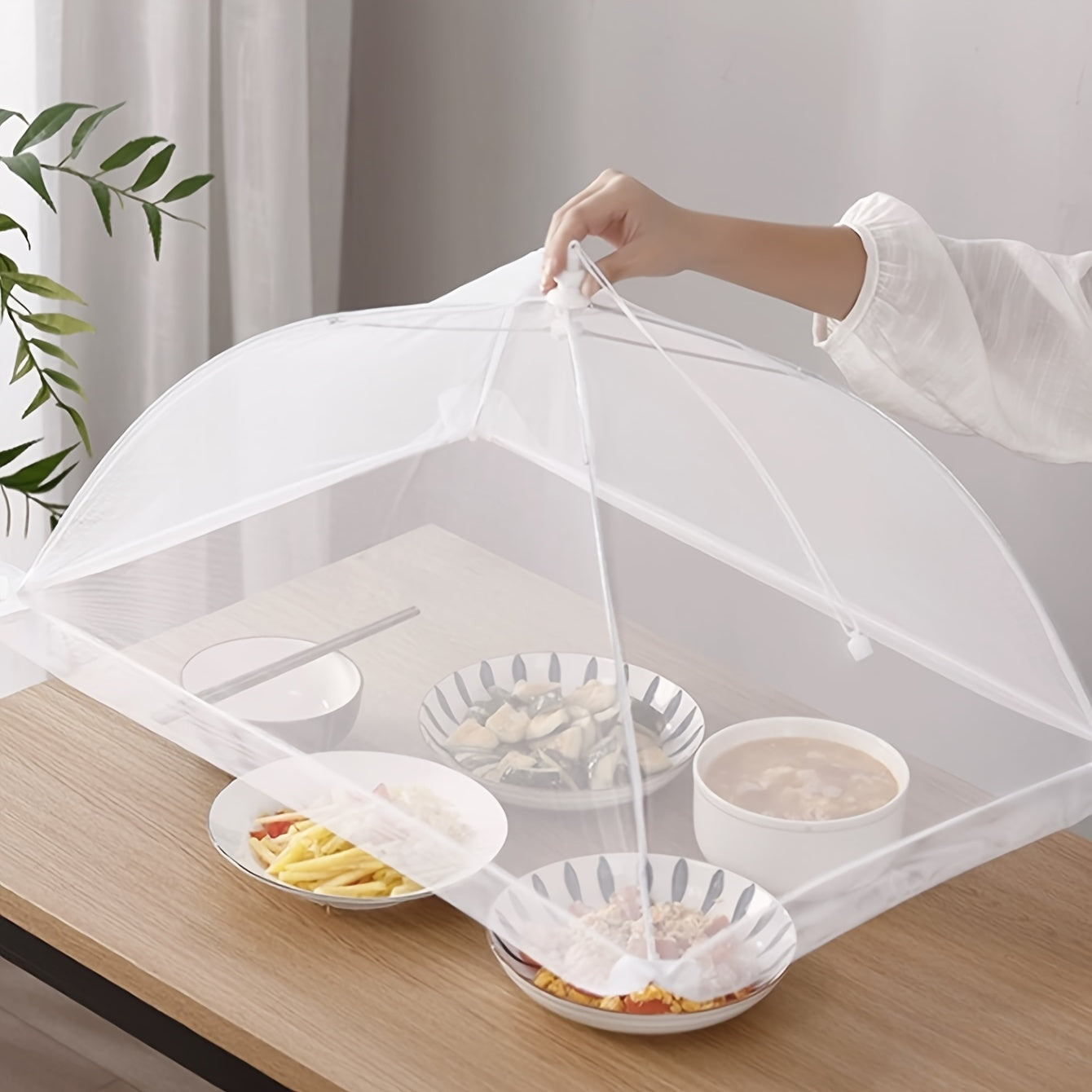 1 white rice cover that doubles as a foldable dining table food cover and household dust cover, suitable for keeping flies away while dining outdoors.