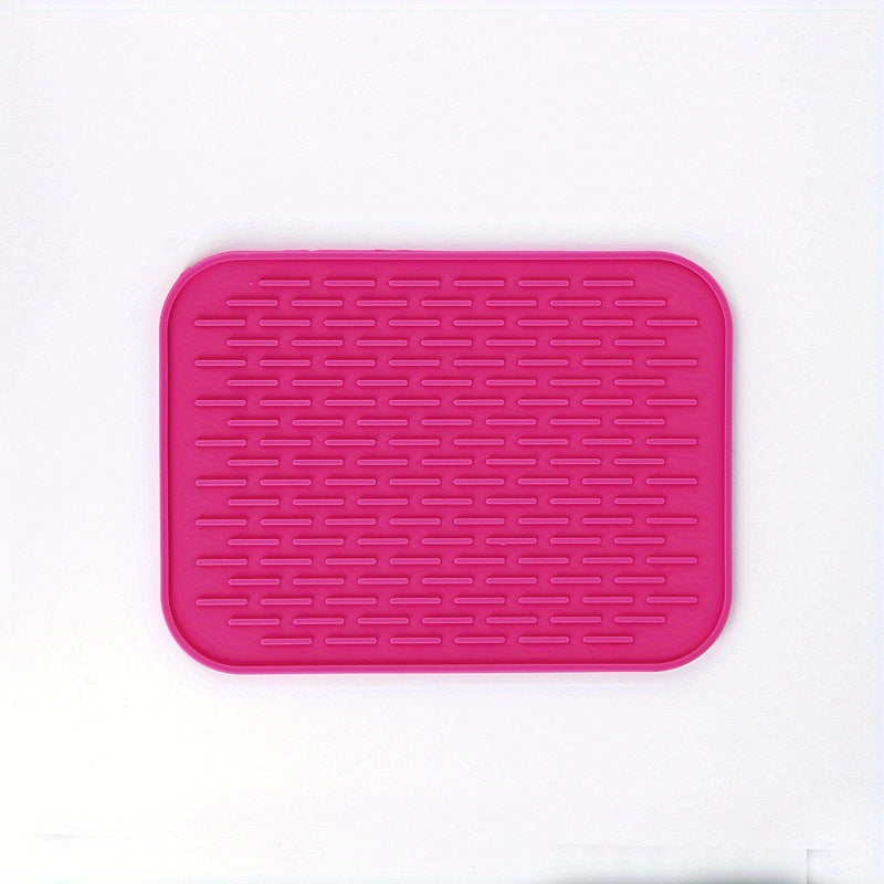 High-quality silicone drying mat for dishes, heat-resistant and non-slip, protects kitchen surfaces, versatile trivet, 21.59cm x 16.0cm, come in vibrant colors.