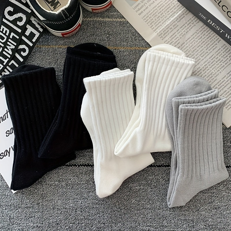 5-Pack of unisex crew socks made with breathable polyester/spandex blend in solid colors that won't fade. Features high waist and sports style, machine washable.