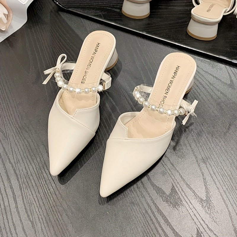 Stylish French-inspired mules for women, featuring a faux pearl ankle strap and chunky heel, perfect for outdoor wear in Summer 2024.