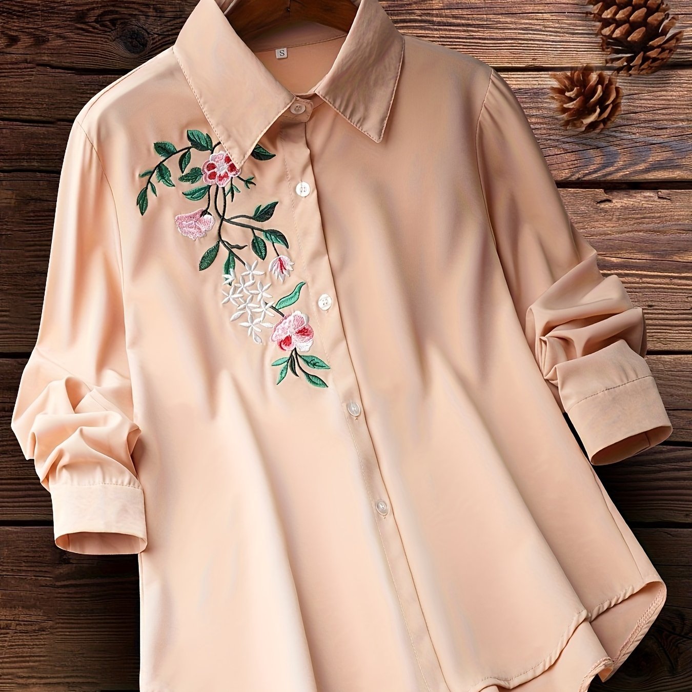 Embroidered floral button-up shirt for women, perfect for spring and fall.