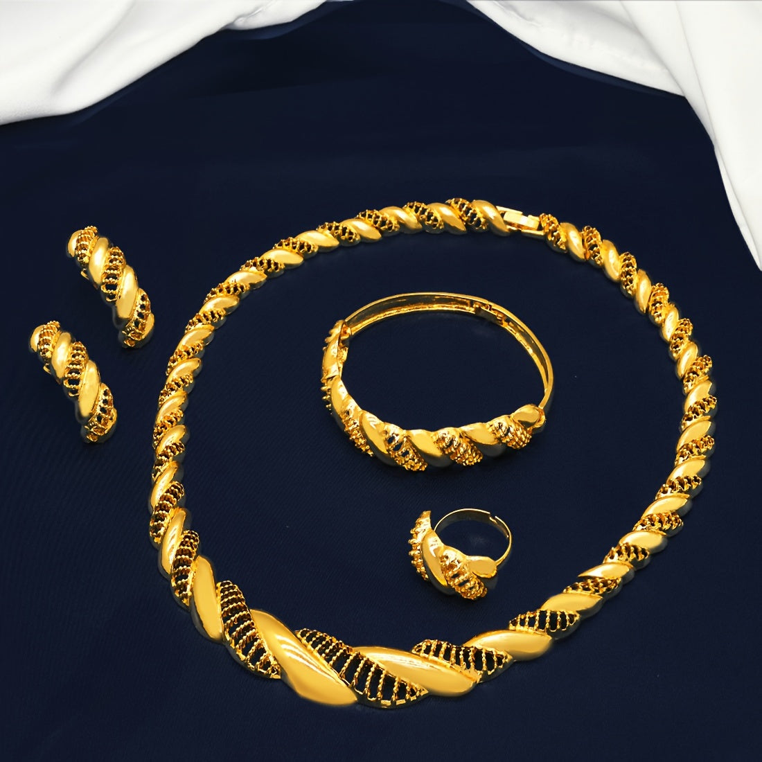 Beautiful bridal jewelry set featuring a golden-tone necklace, bracelet, earrings, and ring with intricate hollow design. Ideal for everyday wear, special occasions, engagements, weddings, and Indian-style events. Makes a perfect gift.