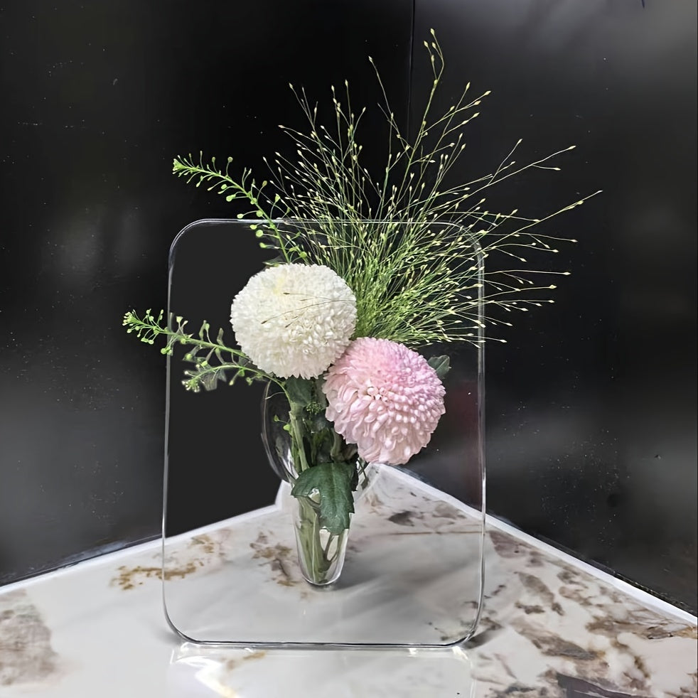 Art Deco-style acrylic resin bud vase with geometric transparent oblong design. Doubles as a creative picture frame. Ideal for home or office décor. Makes a great small gift (flowers not included).