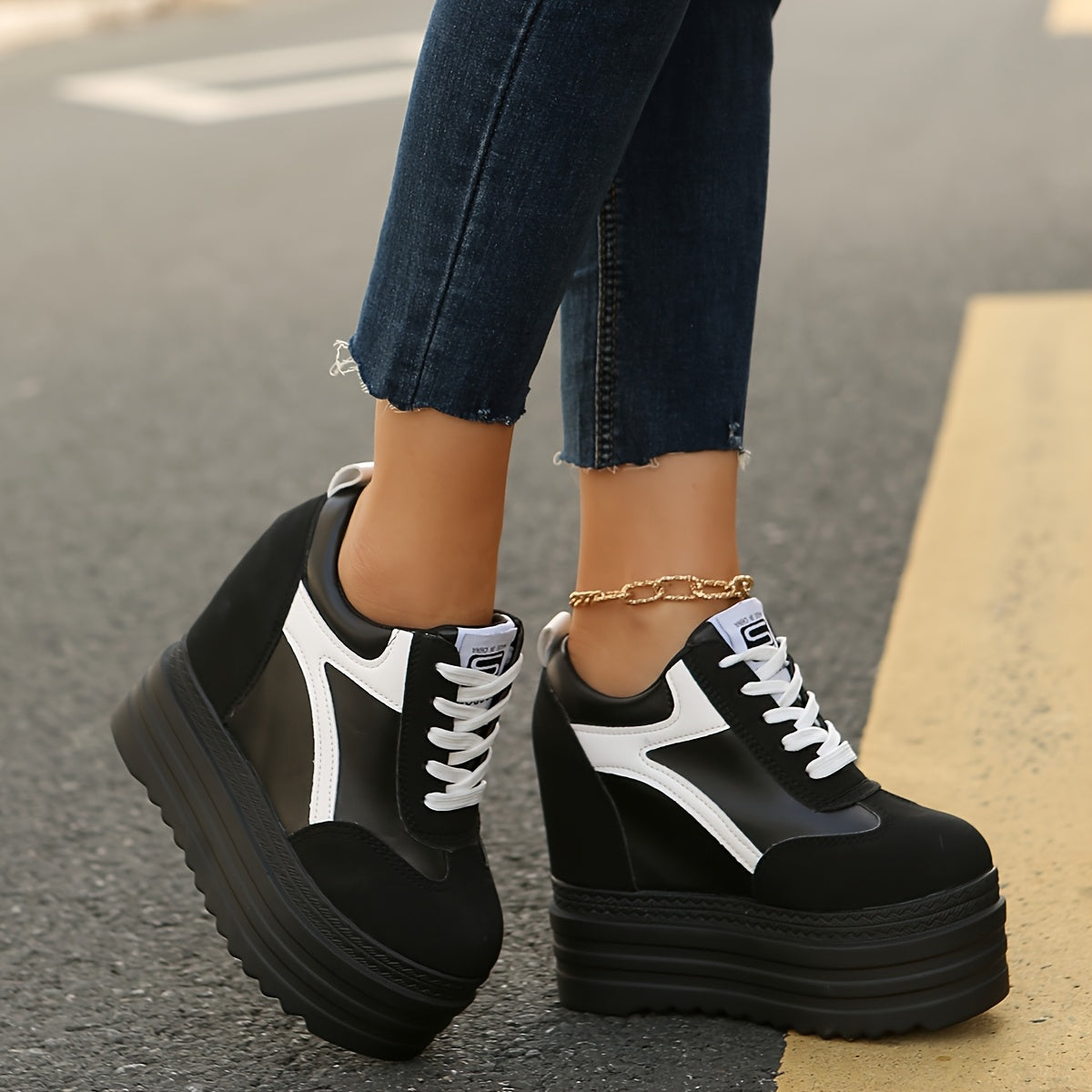 Women's platform sneakers with lace-up closure, fabric lining, lightweight construction, solid color, and low-top design for year-round wear.