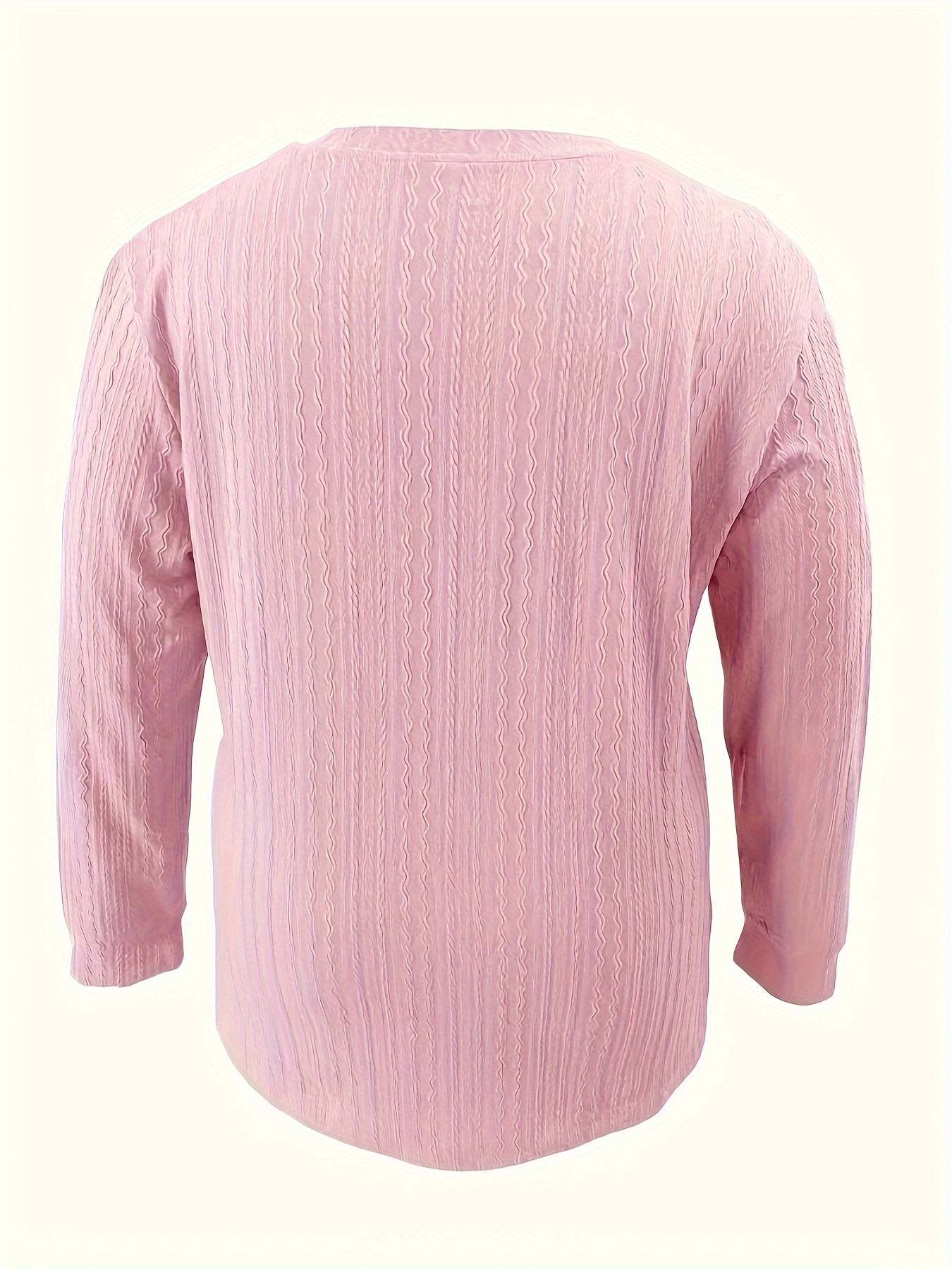 Light pink V-neck shirt with long sleeves and button detail, perfect for fall/winter in soft polyester blend.