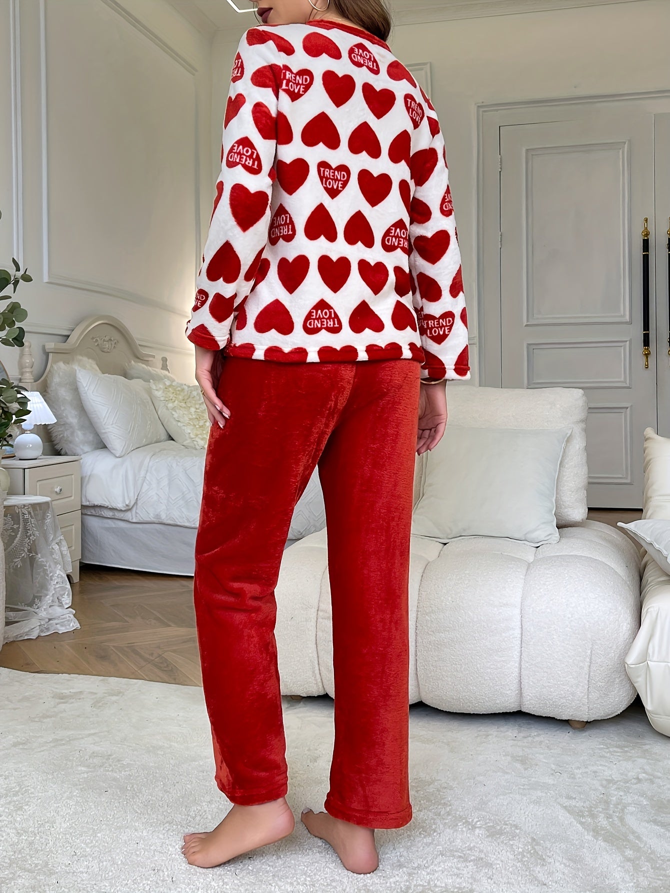 Cozy lounge set for women featuring heart and letter print, perfect for fall and winter. Includes long sleeve top and pants with a relaxed fit.