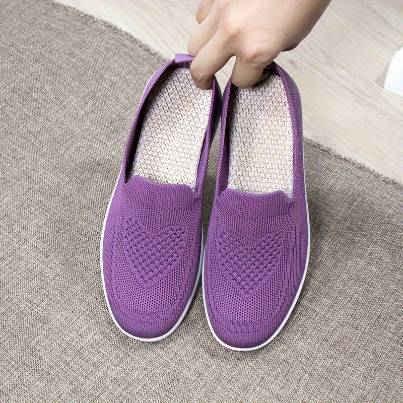 Women's slip-on flats with comfortable fabric upper, flax insole, and faux sole for easy daily wear.