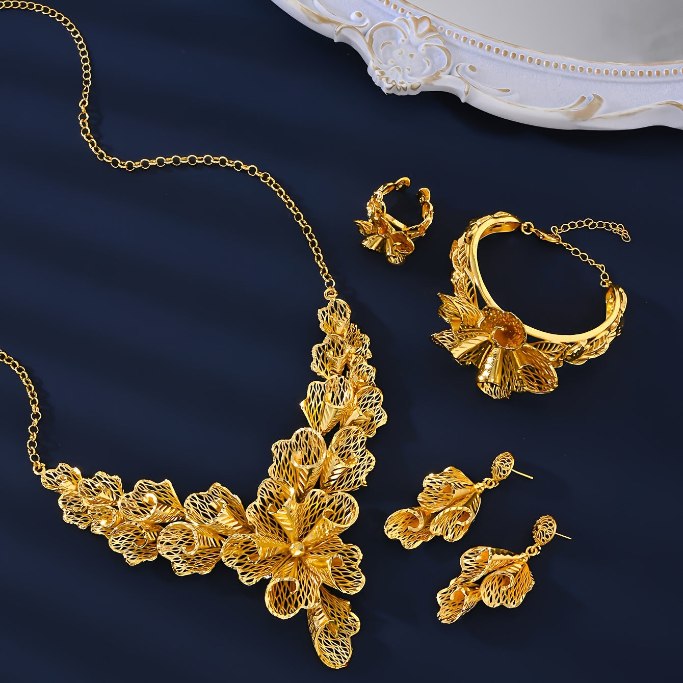 Indulge in the timeless elegance of the MEIZ Vintage Style 18K Golden Plated Copper Jewelry Set - a luxurious 5-piece collection inspired by the opulence of the Middle East. Perfect for women who want to make a statement at parties, festivals, or special