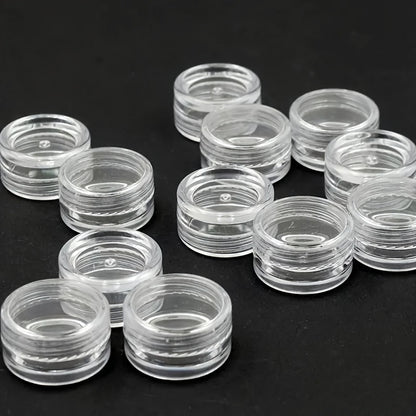 10 clear round plastic containers with secure lids are ideal for storing nail art, glitter, and cosmetic samples. They are lightweight and portable, perfect for bathroom and makeup organization. Ideal for nail care products.