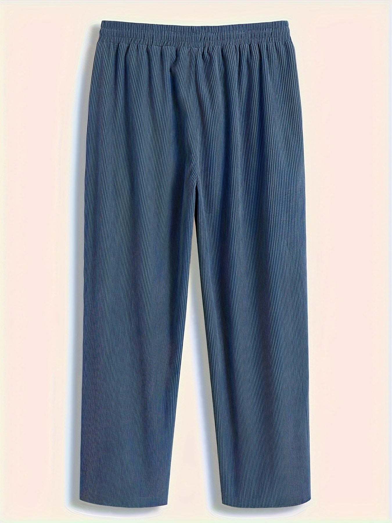 Loose straight-leg corduroy sweatpants in solid color, made of polyester blend with pockets and non-stretch fabric.