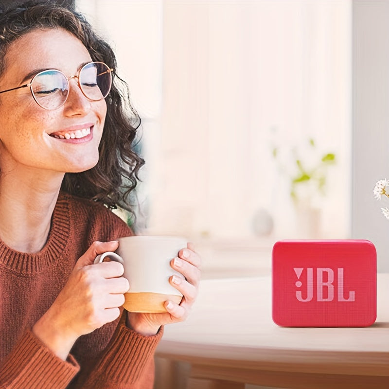 Compact JBL GO ESSENTIAL speaker in Golden Brick Youth Edition with vibrant bass, wireless connectivity, and USB charging. Perfect for use at home, in the car, or outdoors.