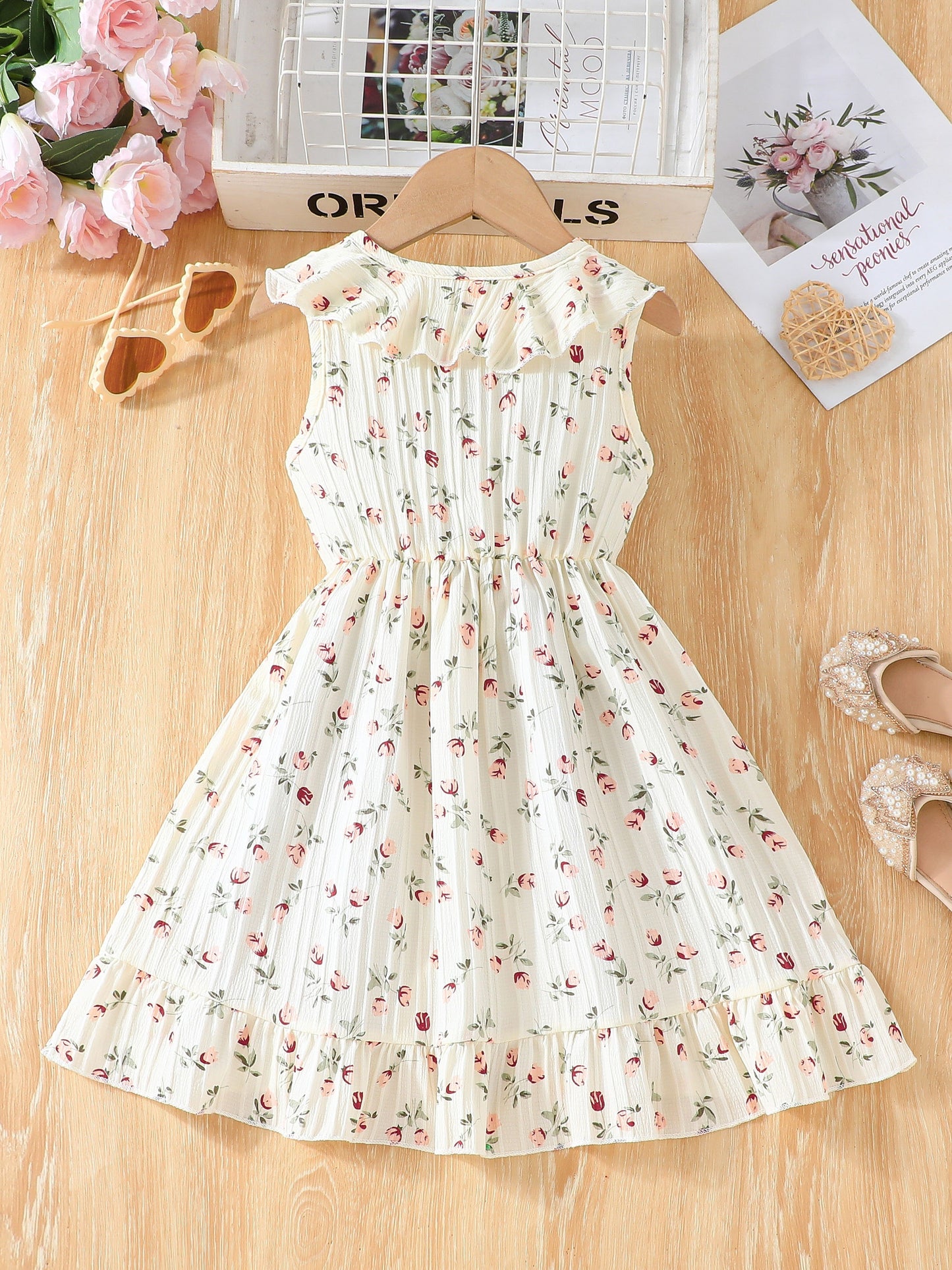 Elegant sleeveless floral dress for girls, perfect for parties and beach outings.