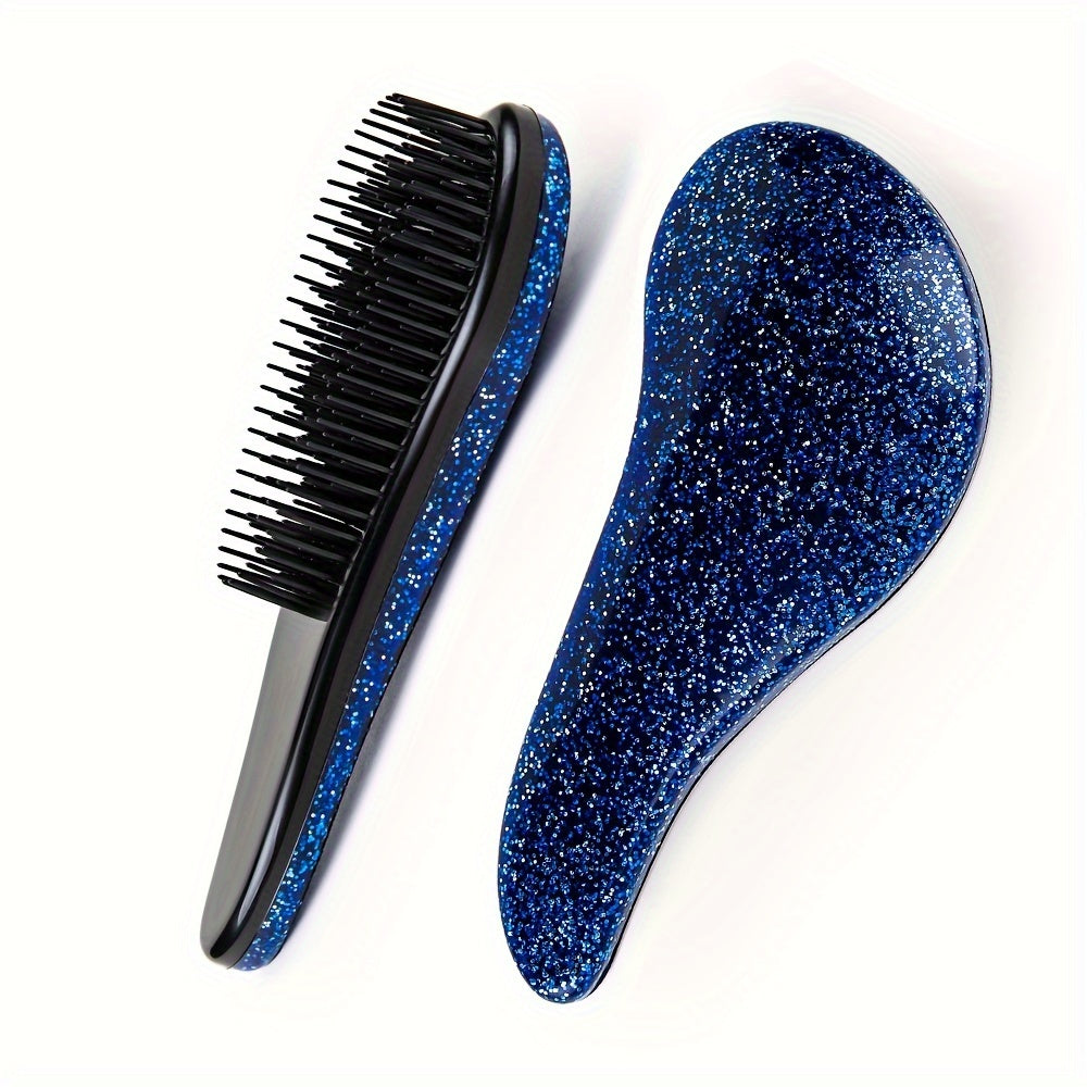 Portable, tiny massage comb for detangling hair with a starry sky design.