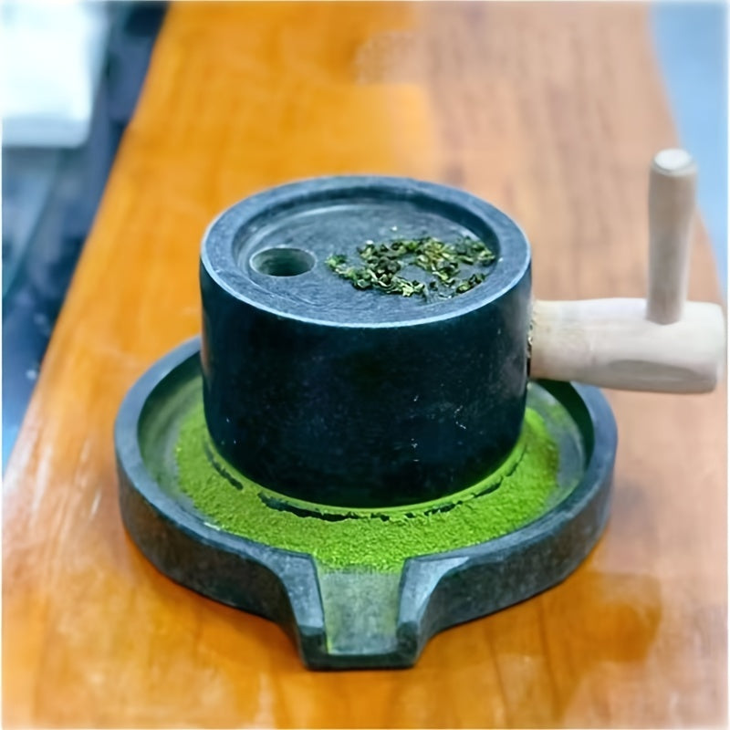 Handcrafted bluestone grinder for tea, coffee, and pepper, along with a matching handmade tea set and stone grinder for matcha. A perfect addition to any household's collection of tea grinding utensils, complete with beautiful graphite ornaments.