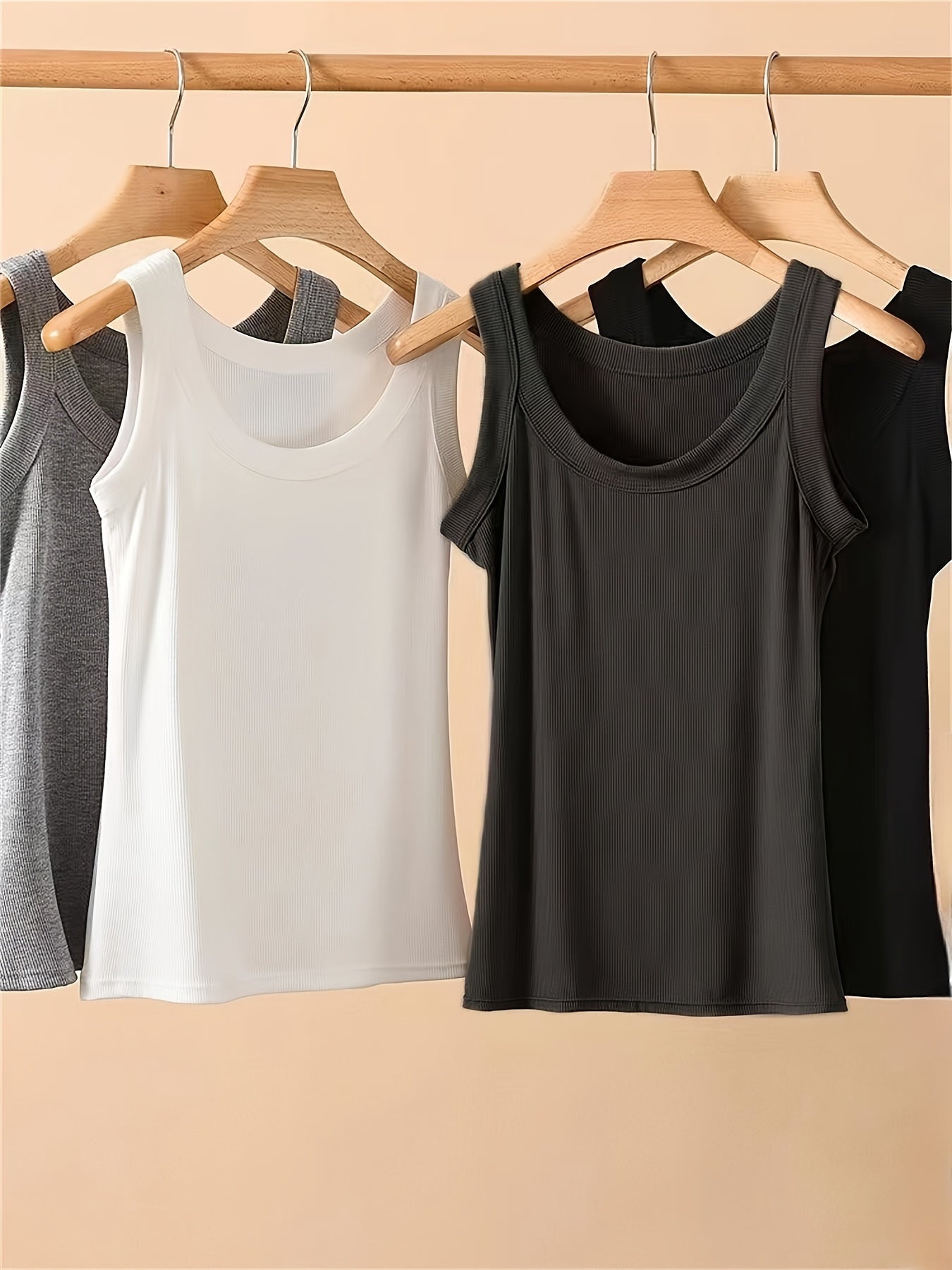 Set of 4 U-neck camisole vests for women, perfect for spring/summer. Can be worn as an outer layer or as a sleeveless base shirt. Features low neckline for breathability and comfort.