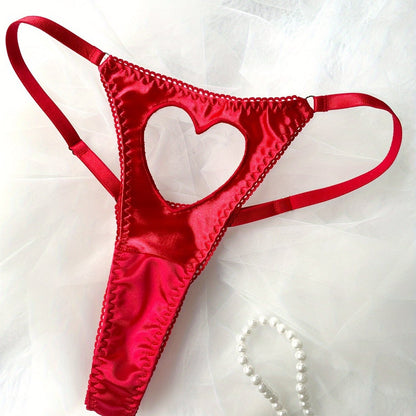 Thong-style lingerie with heart cut-outs and linked rings for a sexy look.