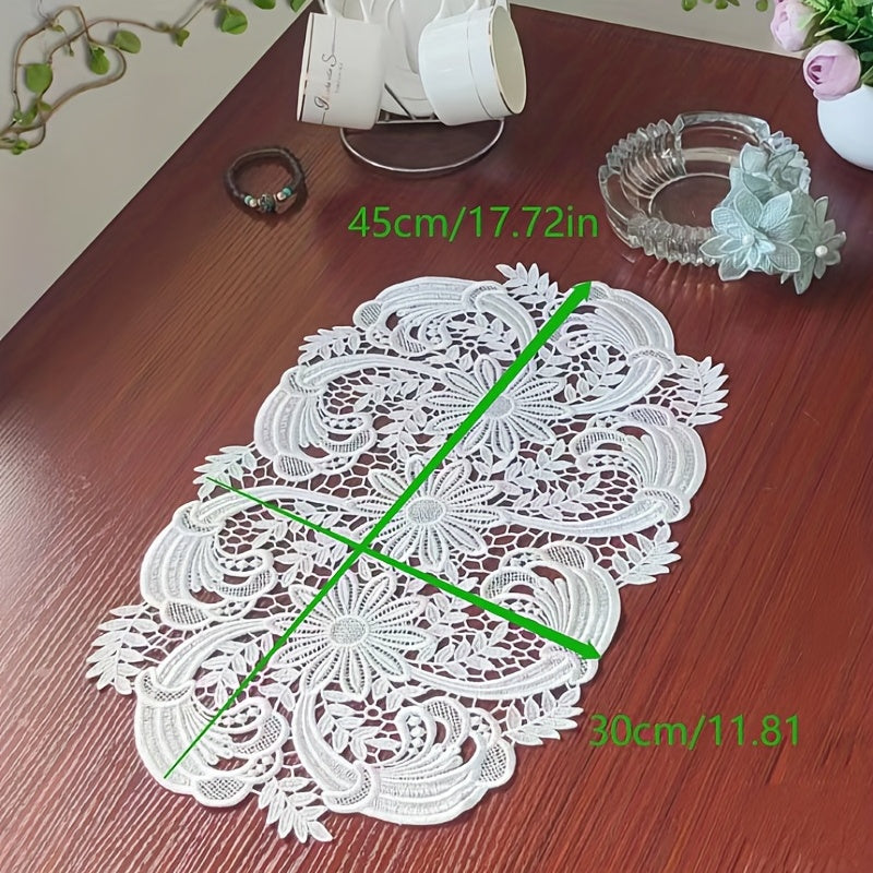 White velvet lace oval table runner with floral pattern, perfect for holiday table setting. Butterfly motif on decorative fabric for dining and home decor.