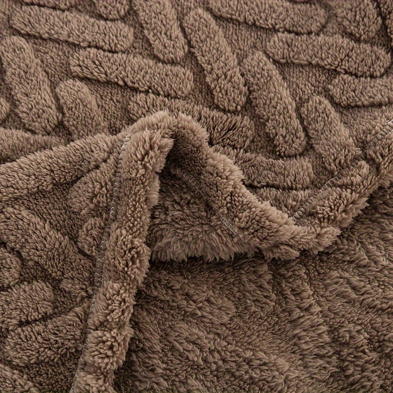 One piece of a high-weight, double-sided plush fleece throw blanket in a contemporary brown style. This blanket is machine washable and suitable for all seasons. Made of knitted polyester with a jacquard design, it features no prints and is perfect for