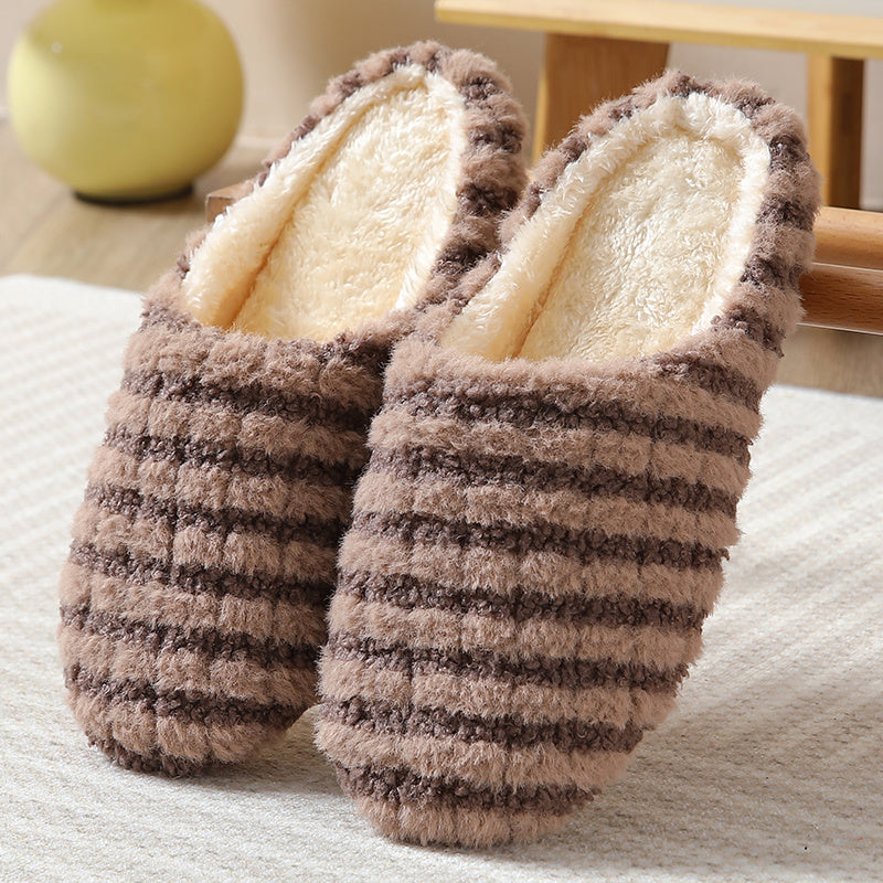 Women's striped print plush house slippers with anti-slip sole for indoor use.