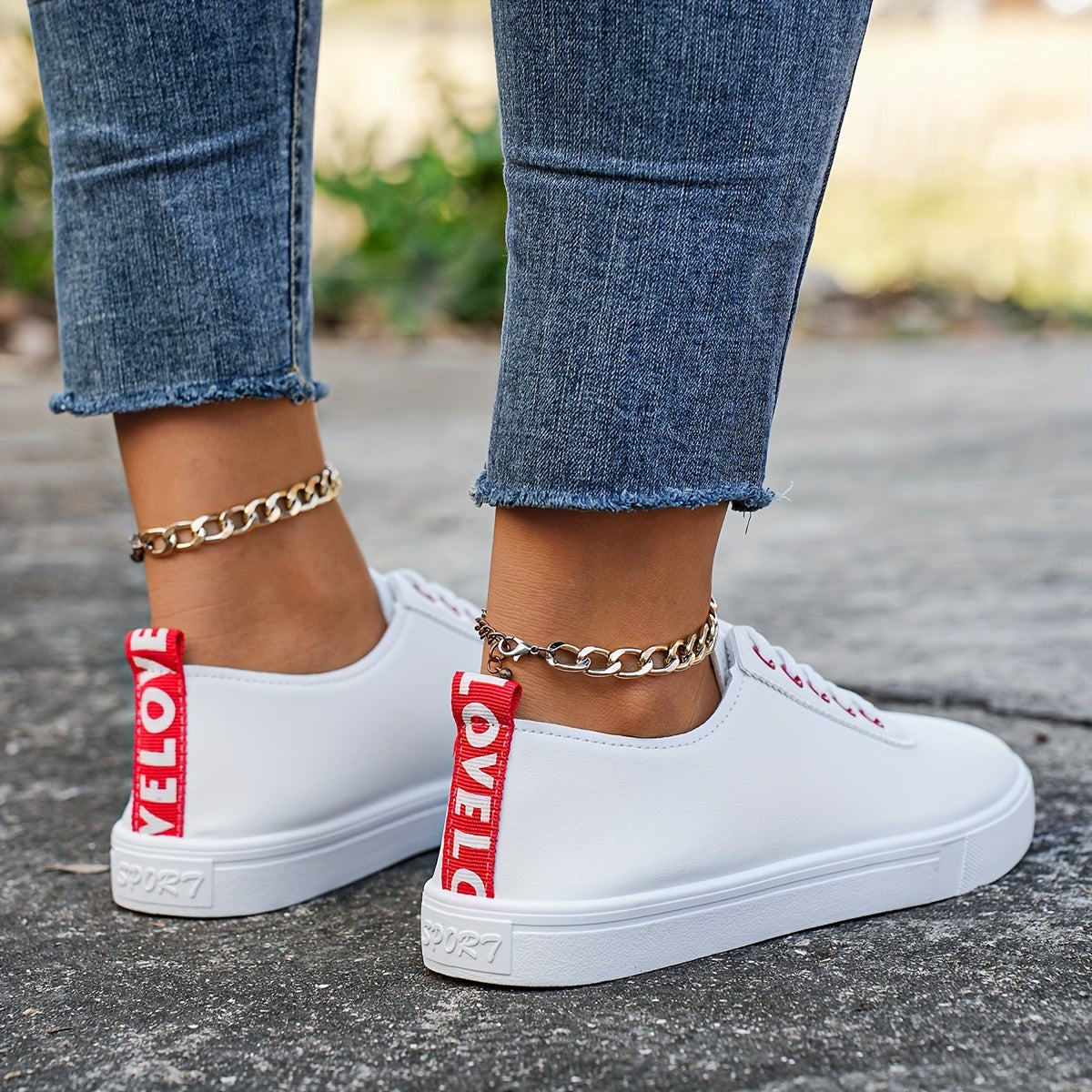 Versatile women's white sneakers with classic design, lace-up closure, round toe, and rubber sole for all seasons. Made with faux leather upper and comfortable fabric lining.