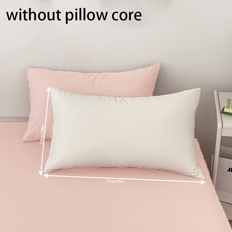 Get two ultra-soft brushed polyester pillowcases, weighing 90g each in a sleek light purple color. These rectangular pillowcases measure 50.8x76.2cm and feature an envelope closure. They are machine washable and perfect for adding cozy comfort to your