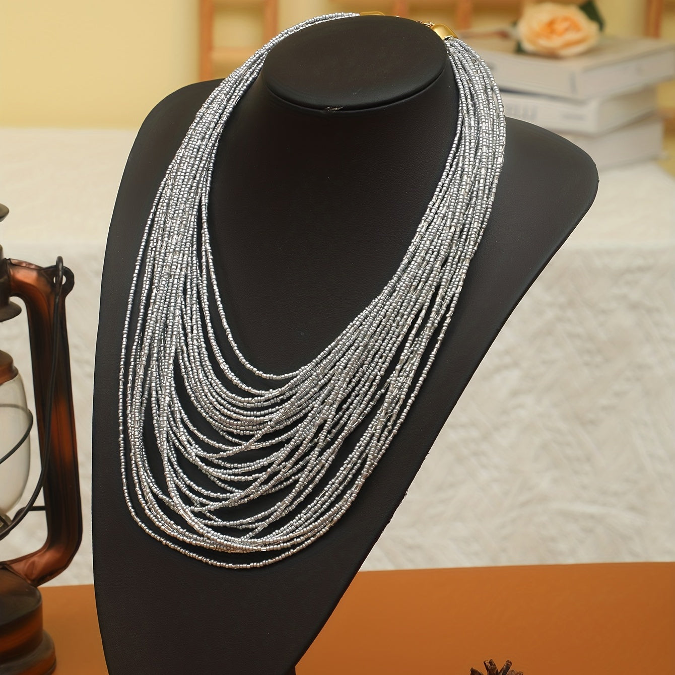 A trendy and flexible millet bead necklace with multiple layers.