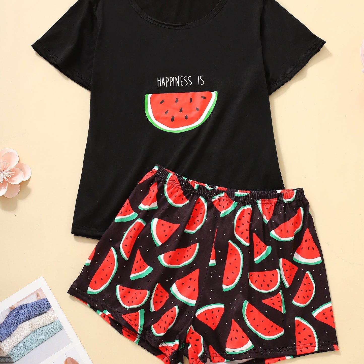 Women's loungewear set with watermelon and letter print, including short sleeve top and elastic shorts.