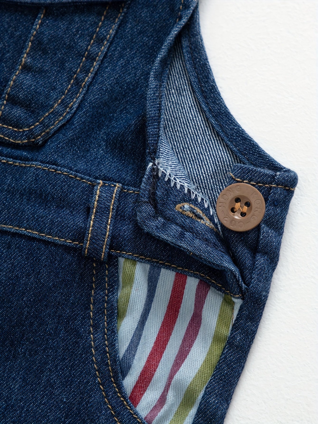 Children's denim overalls with embroidered animal designs, made of a cotton blend with slight stretch, suitable for outdoor wear in the spring and fall.