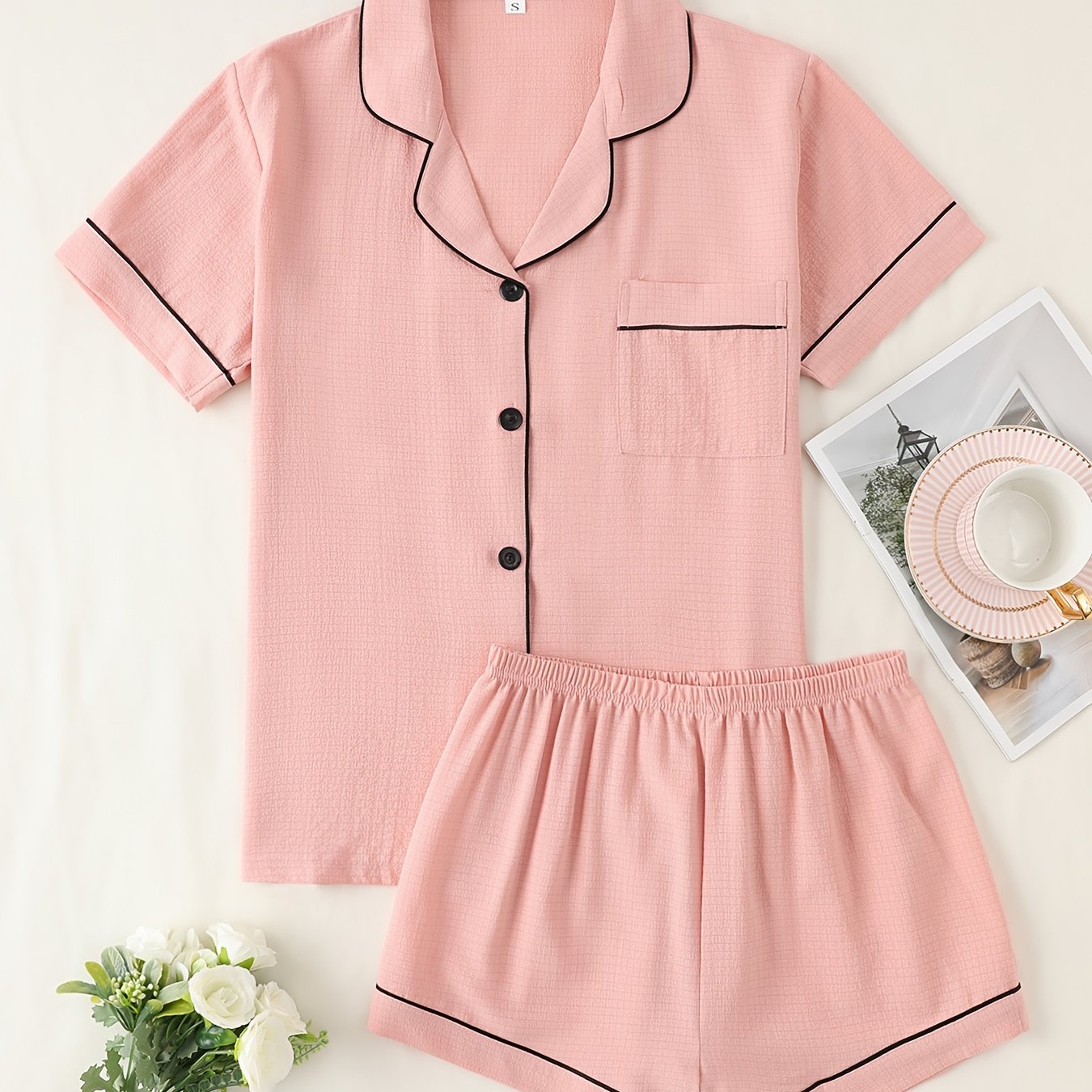 Basic pajama set for women, featuring a short-sleeve button-up top with lapel collar and elastic shorts.