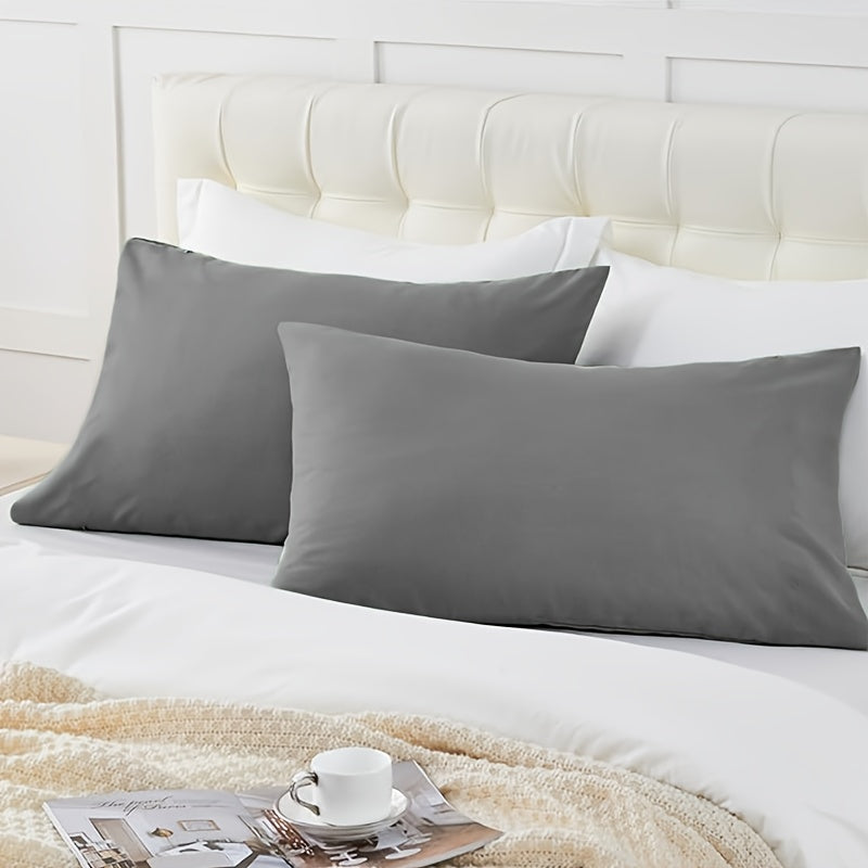 Enhance your bedroom, guest room, or hotel with our 2-piece set of solid color versatile pillowcases. Made from soft and breathable material with a frosted treatment, these pillowcases are conveniently machine washable. Available in three classic colors