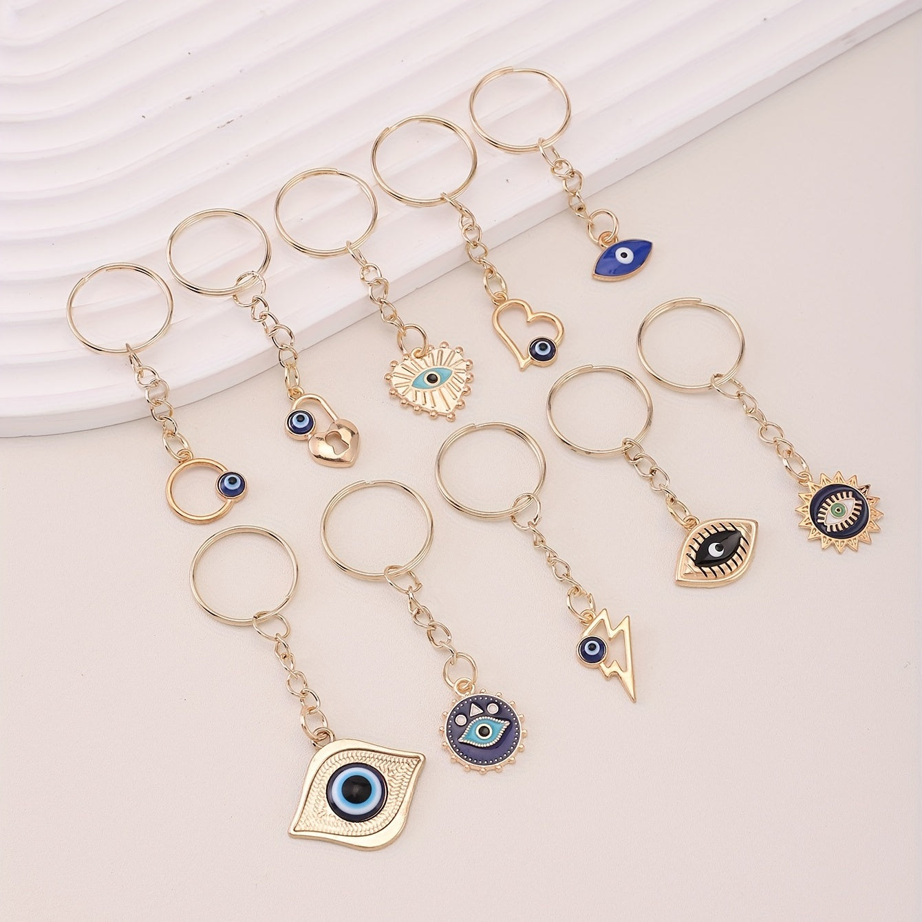 A set of 10 Evil Eye keychain amulets for good luck, perfect for attaching to your keys, purse, bag, backpack, or car keys. These charms also make great party favors or accessories for making jewelry gifts.