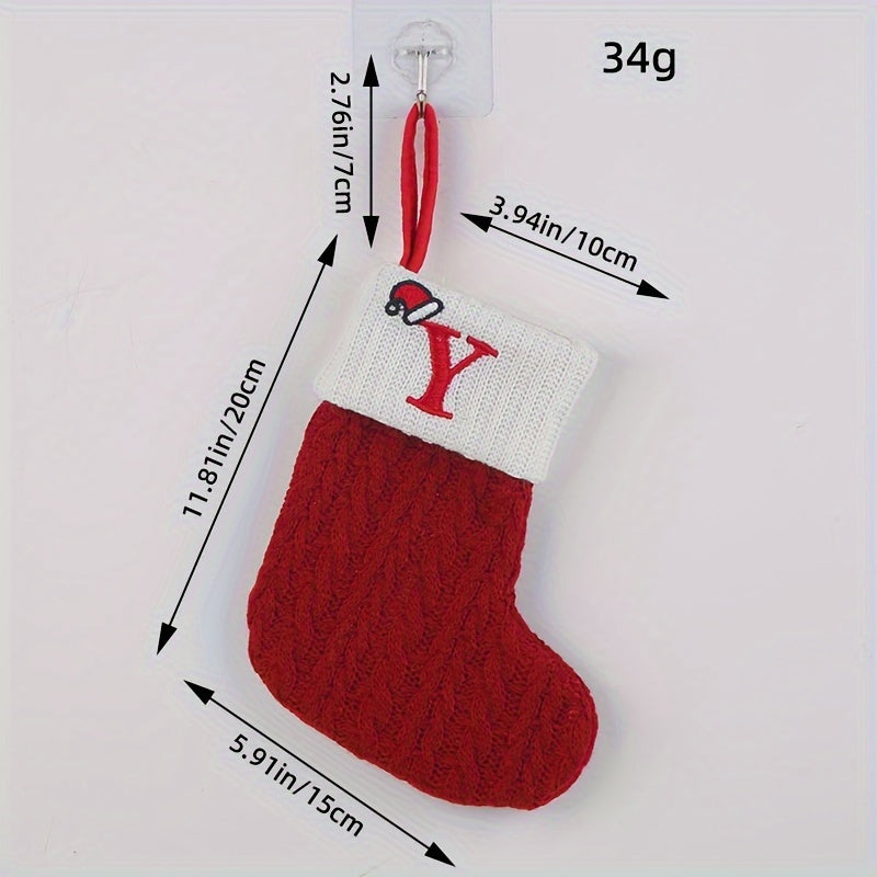 Knitted letter Christmas socks for home tree ornaments; red socks in gift bag for festive attire.