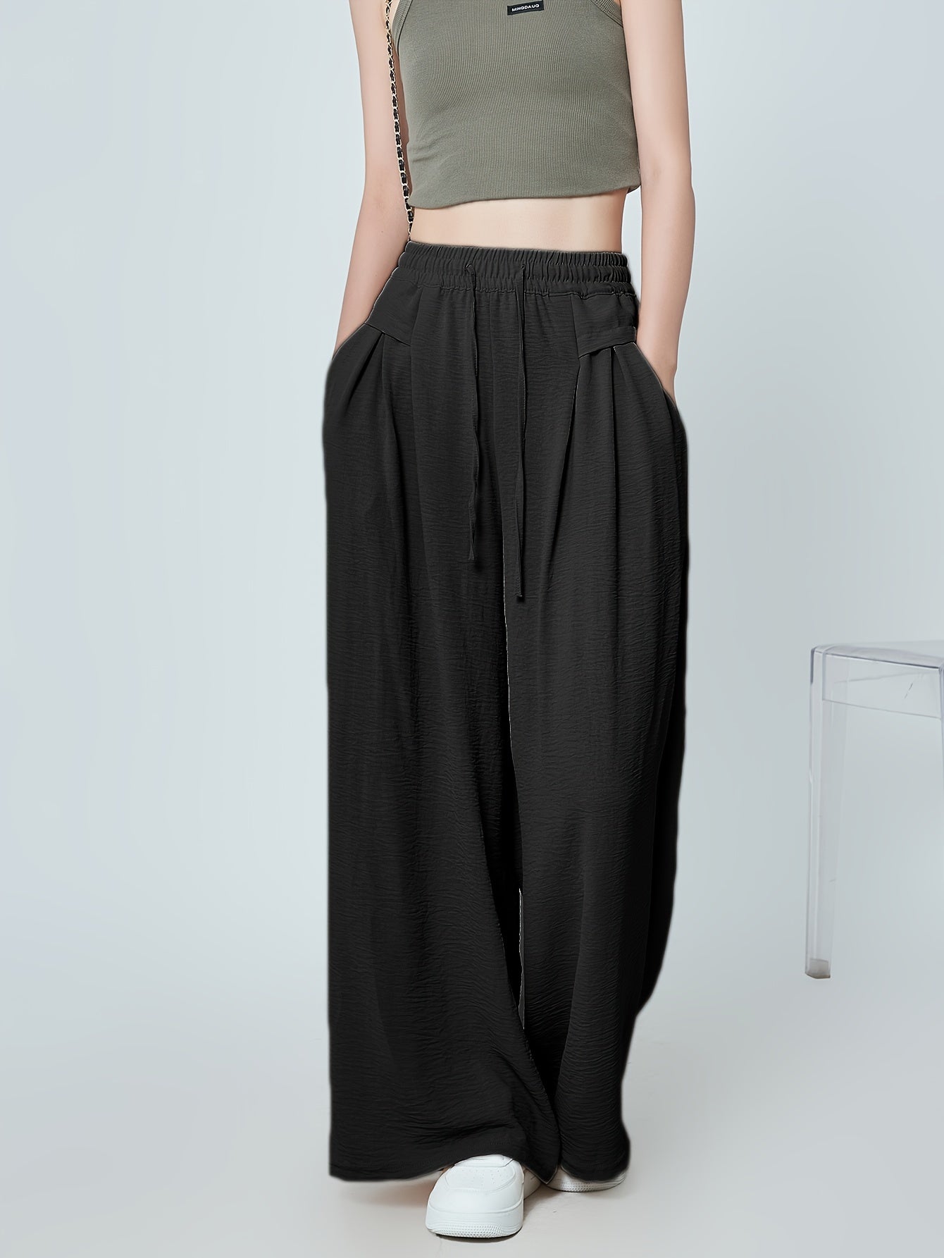 Stylish lounge bottoms with elastic drawstring, pleated detail, and wide leg fit for women's loungewear.