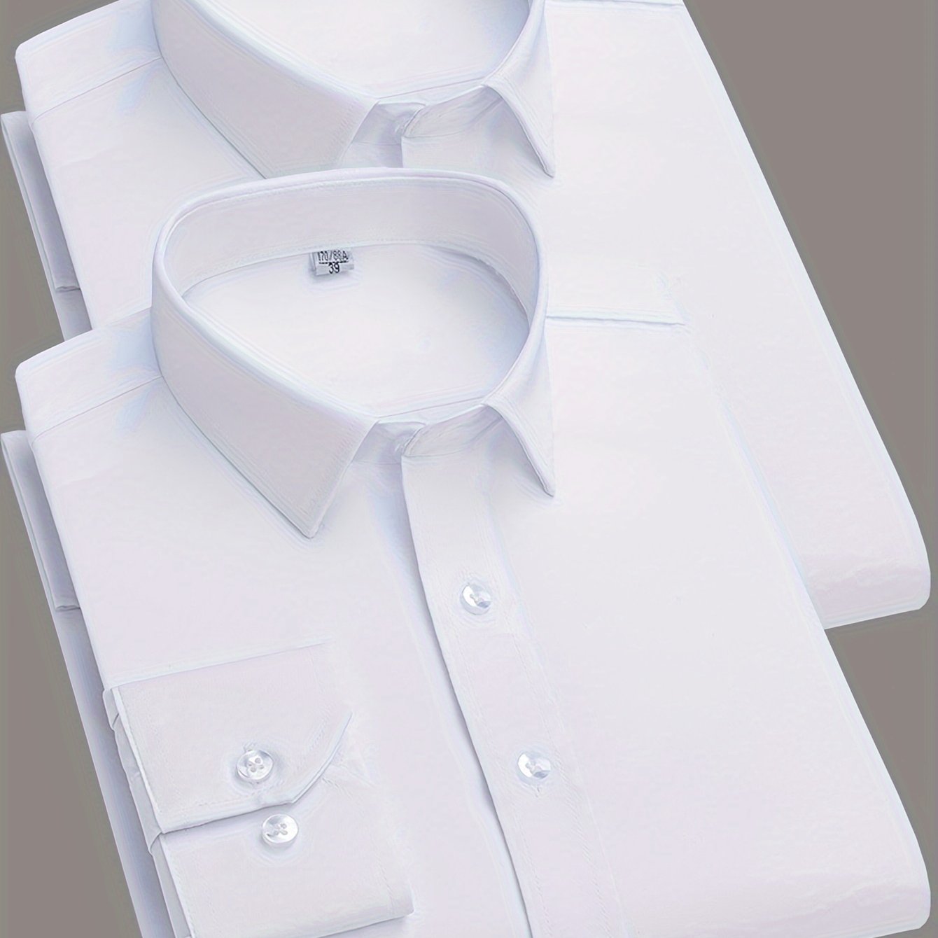 2 Men's work style polyester dress shirts in solid colors, regular fit with button details and lapel collar.