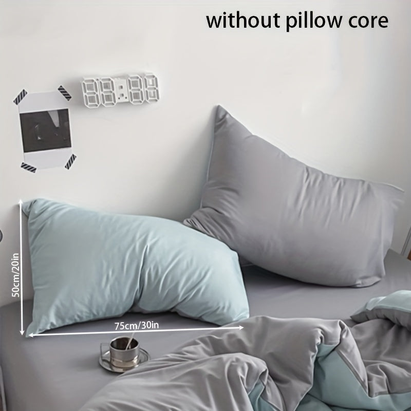 Get two ultra-soft brushed polyester pillowcases, weighing 90g each in a sleek light purple color. These rectangular pillowcases measure 50.8x76.2cm and feature an envelope closure. They are machine washable and perfect for adding cozy comfort to your