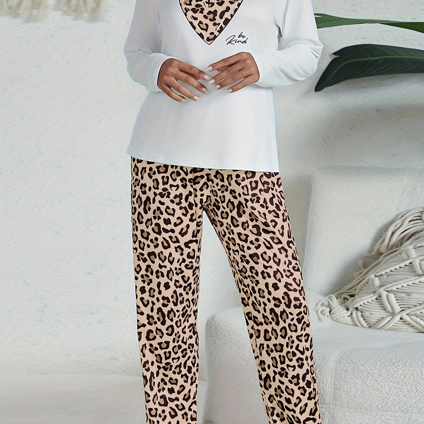 Casual leopard pajama set with long sleeve heart print top and pants for women's sleepwear and loungewear.