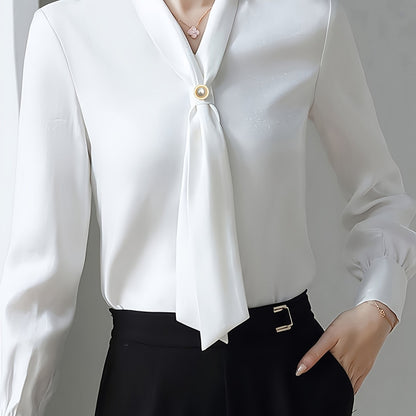 Stylish V-neck shirt with bow tie decoration for women, made of 100% polyester. Regular fit with single breasted placket. Woven fabric, suitable for all seasons.