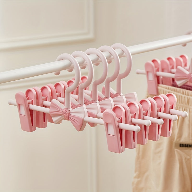 Convenient 27.94-68.58 cm Retractable Plastic Pants Hanger with Bow Clips - Ideal for Children's Clothing