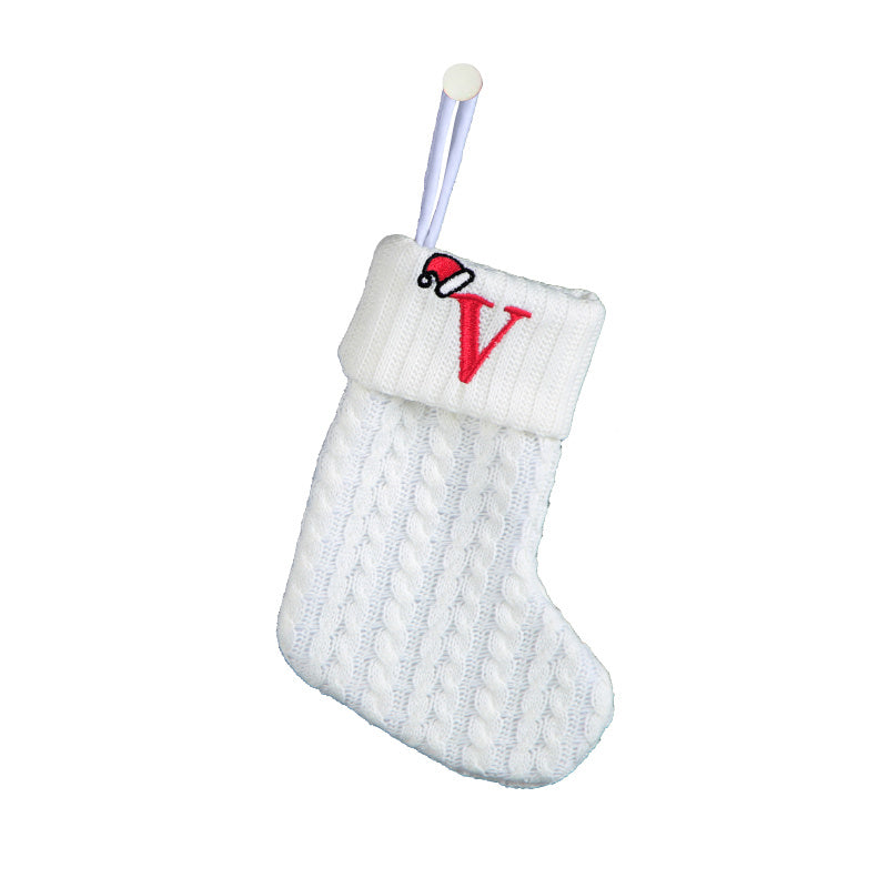 White cable knit stocking with embroidered 'F' - Ideal for indoor decor.