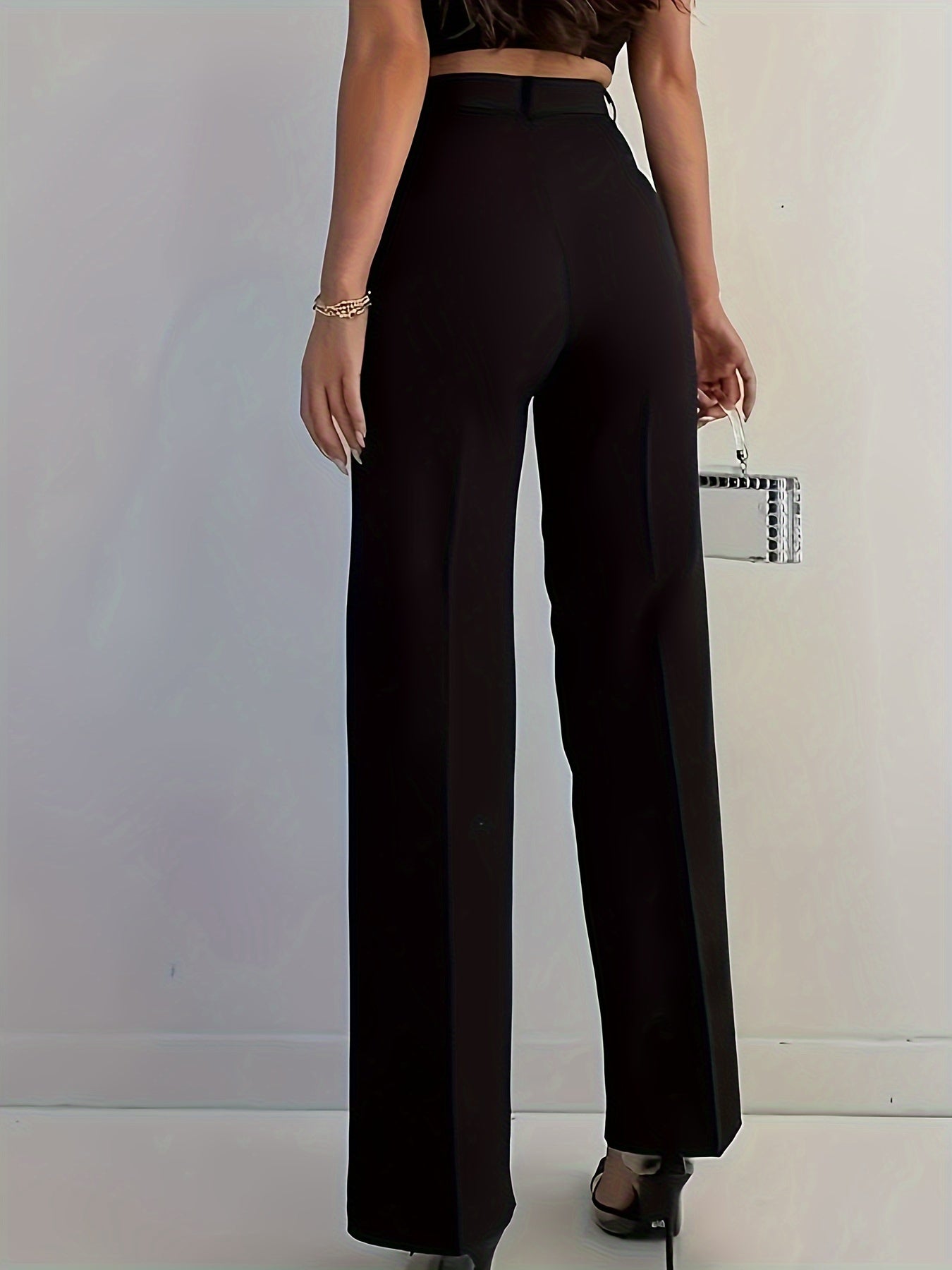 Stylish women's black pants, high-waisted, sleek polyester material, machine washable - suitable for professional and social occasions.