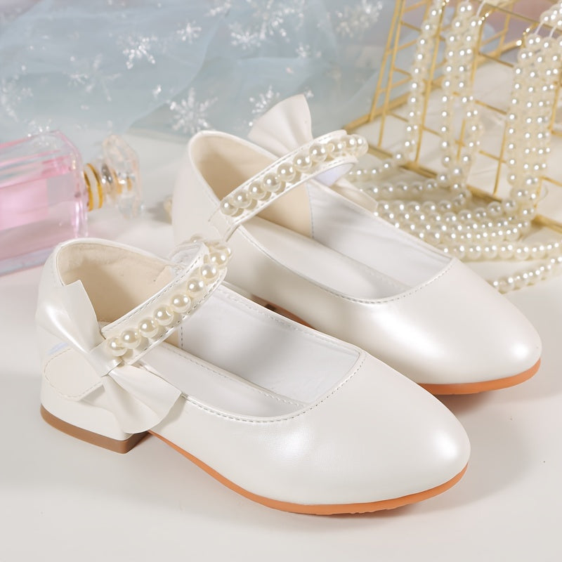 Princess high heels for girls with pearl accents and bowknot. Breathable and non-slip, perfect for school, parties, and formal events. White synthetic material with chunky heel and round