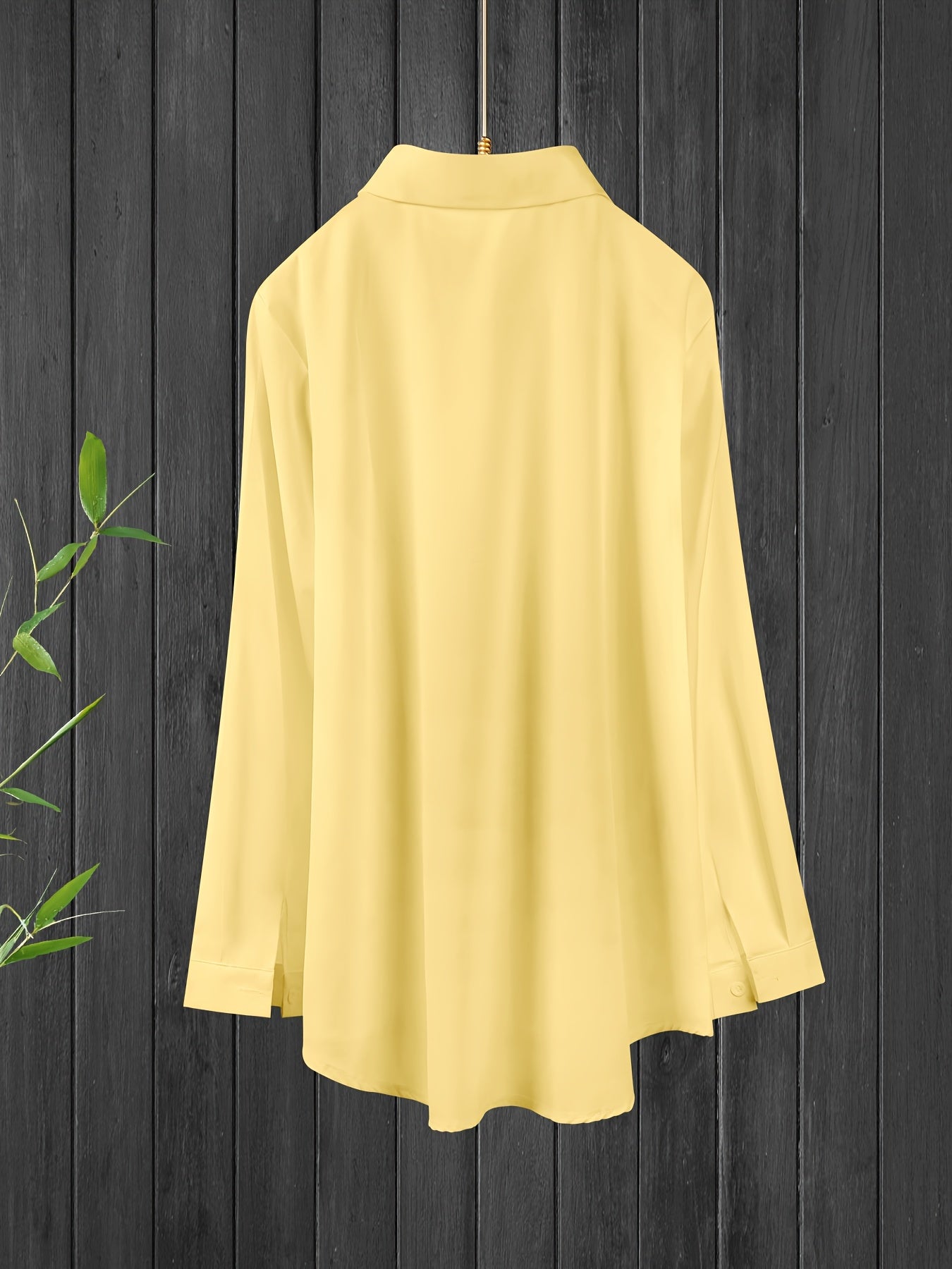 Long sleeve button front shirt in solid color for plus size women.