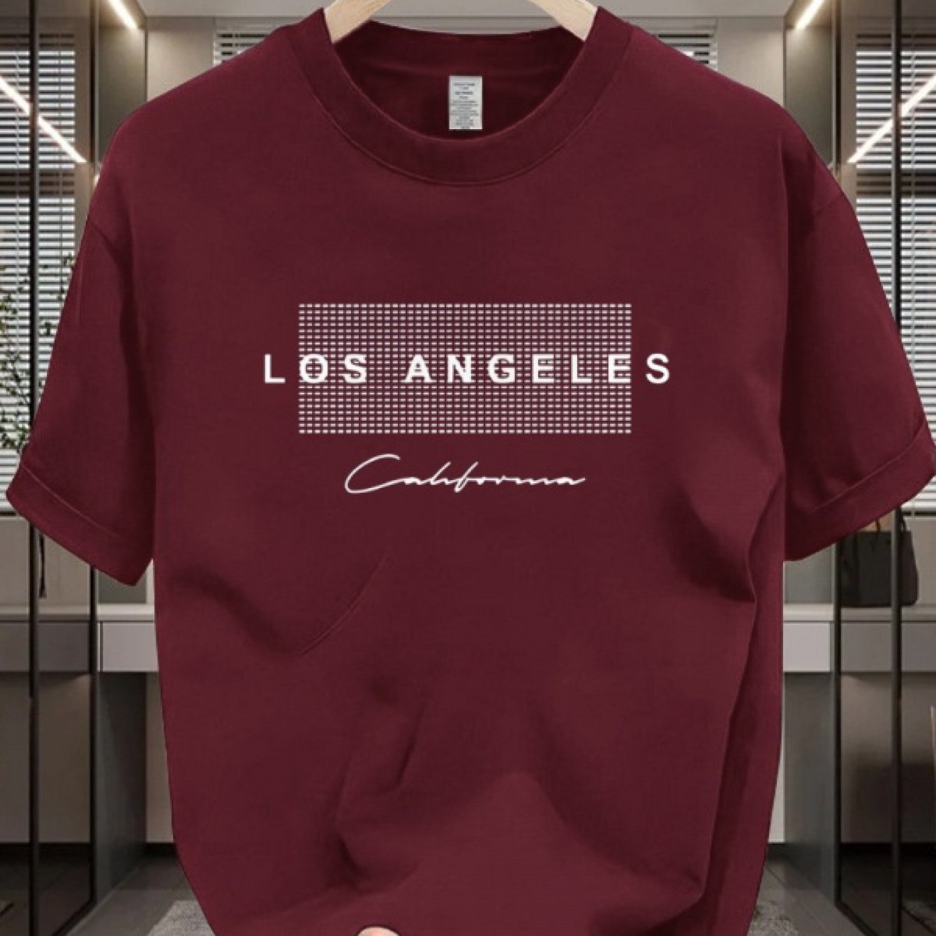 Men's casual cotton T-shirt with crew neck and short sleeves. Made from 100% cotton knit fabric, providing all-season comfort. Features a solid color and a Los Angeles California graphic