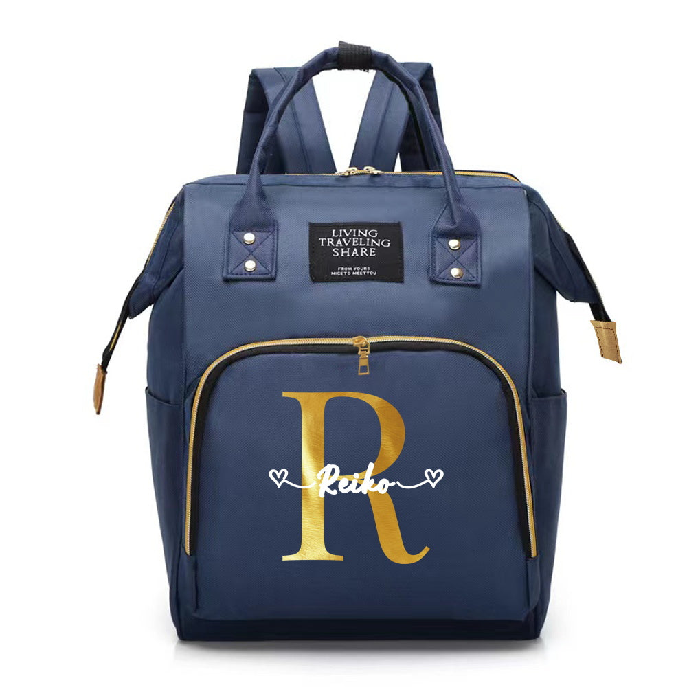 Customize your Oxford cloth diaper bag with your own initial, featuring a large capacity and soft shell. This mommy backpack is perfect for casual travel and comes with a convenient bottle nursing storage organizer for women.