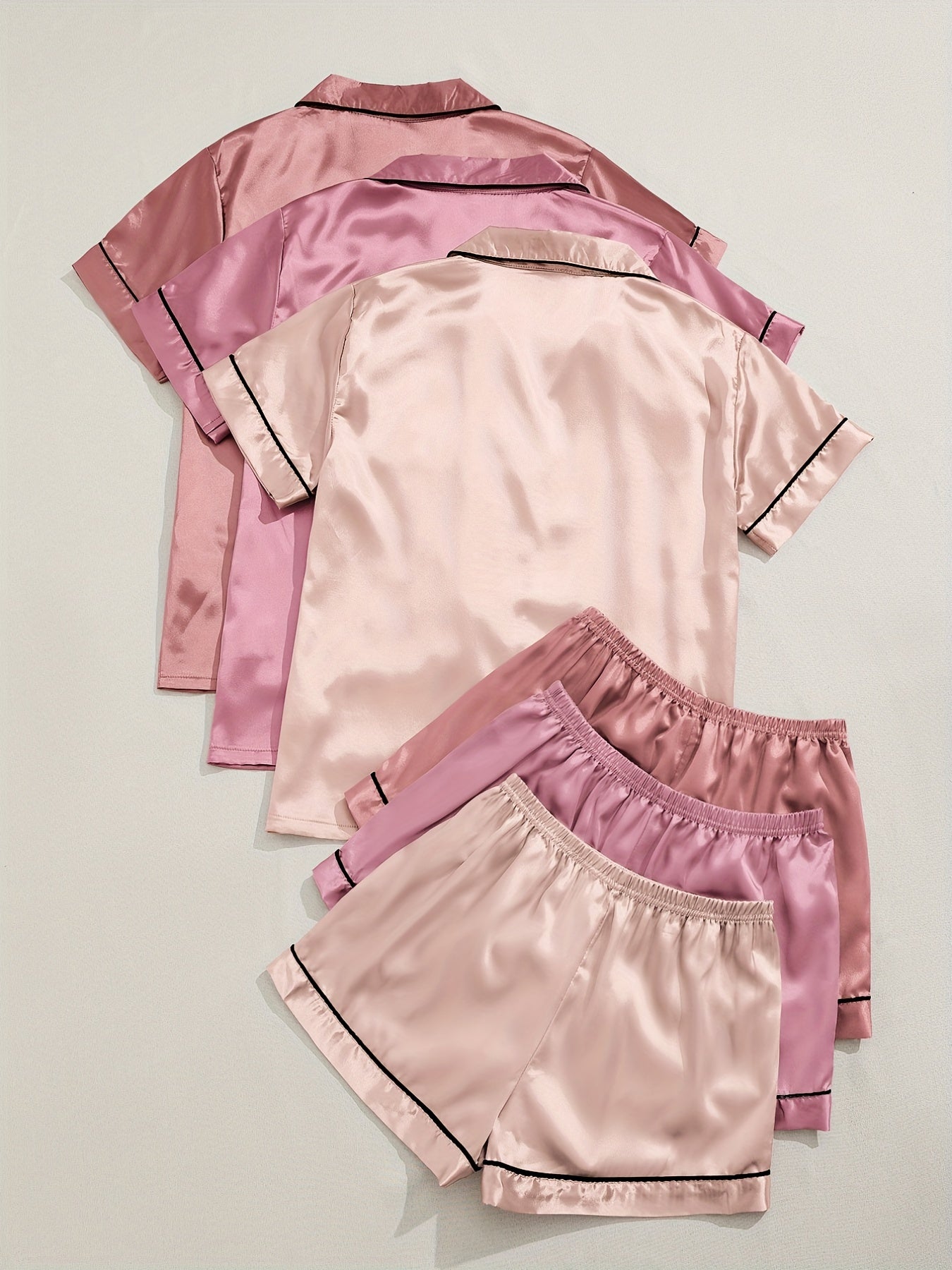 Women's two-piece pajama set in multicolor variety of short-sleeved shorts and solid color imitation satin.