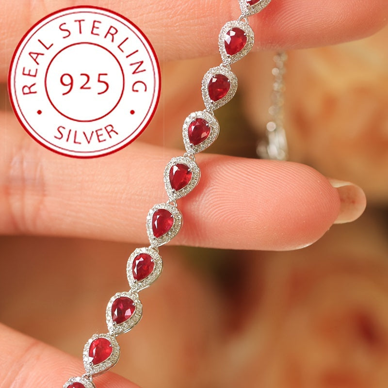 Stylish Sterling Silver Bracelet with Synthetic Red Gemstones and Celestial Theme, featuring zirconia Mosaic. This 925 Silver Plated Jewelry makes a perfect gift for December birthdays, special occasions, or Valentine's Day. A versatile fashion accessory