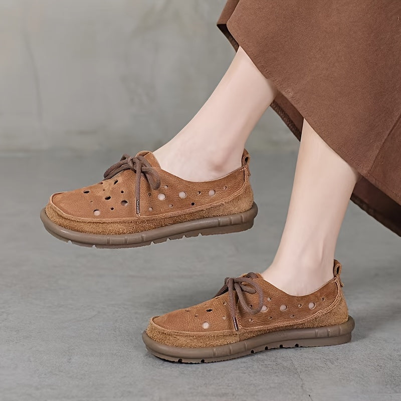 Genuine leather loafers with perforated design and lace-up closure, featuring a soft rubber sole for comfort. Brown leather shoes ideal for summer, offering breathability and style. Stylish