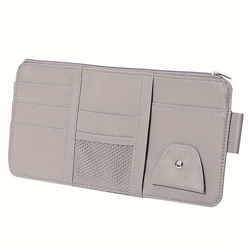 Stylish visor organizer with compartments for glasses, CDs, smartphones, wallets, and cards. Durable and compact design.