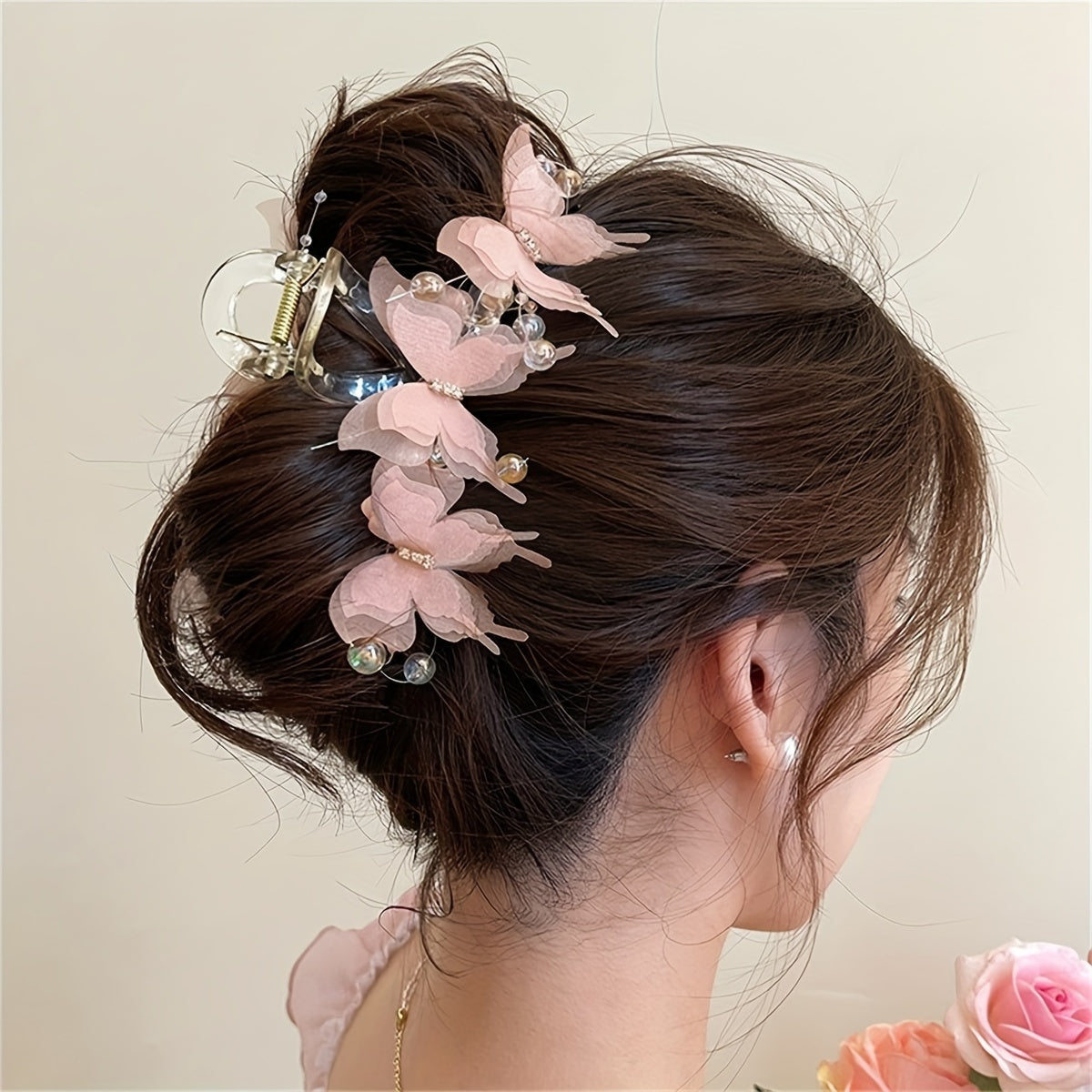 Stylish golden butterfly hair clip with crystal beads - perfect for chic updos & buns.