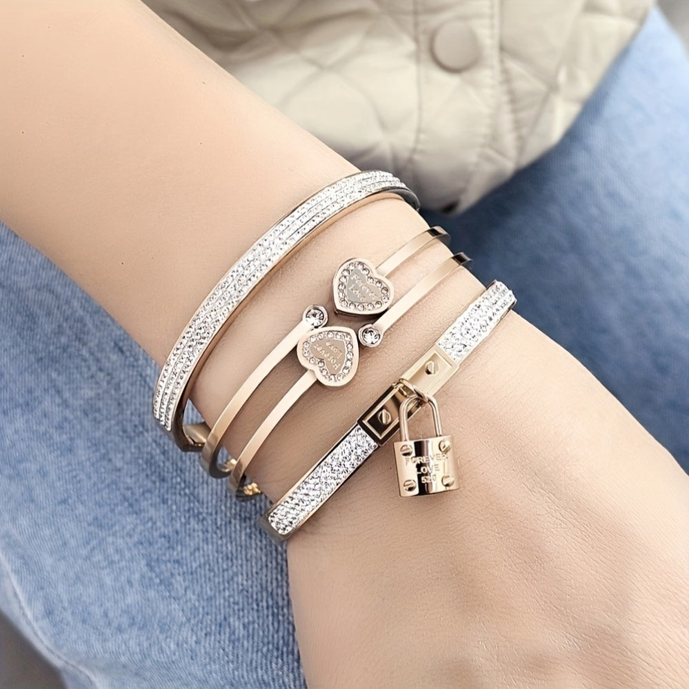 Stylish set of 3 stainless steel bracelets for women, plated in 18K gold with a heart-shaped pendant adorned with sparkling synthetic zirconia. The perfect luxury gift for weddings, parties, and Christmas, suitable for all seasons.